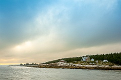 Sun Breaking Over Heavy Clouds by Whitehead Lighthouse